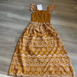 Beautiful summer address mustard and white color size medium for every day.